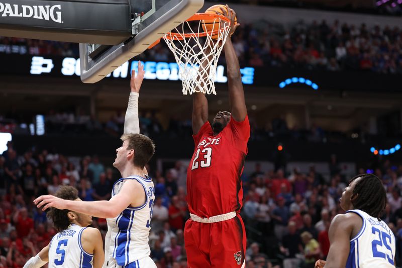 Mar 31, 2024; Dallas, TX, USA; North Carolina State Wolfpack forward Mohamed Diarra (23) shoots against Duke Blue Devils center Kyle Filipowski (30) in the second half in the finals of the South Regional of the 2024 NCAA Tournament at American Airline Center. Mandatory Credit: Kevin Jairaj-USA TODAY Sports