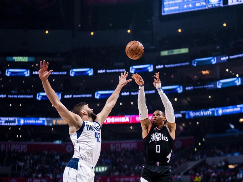 LOS ANGELES, CA - APRIL 23: Russell Westbrook #0 of the LA Clippers shoots the ball during the game against the Dallas Mavericks during Round 1 Game 2 of the 2024 NBA Playoffs on April 23, 2024 at Crypto.Com Arena in Los Angeles, California. NOTE TO USER: User expressly acknowledges and agrees that, by downloading and/or using this Photograph, user is consenting to the terms and conditions of the Getty Images License Agreement. Mandatory Copyright Notice: Copyright 2024 NBAE (Photo by Tyler Ross/NBAE via Getty Images)