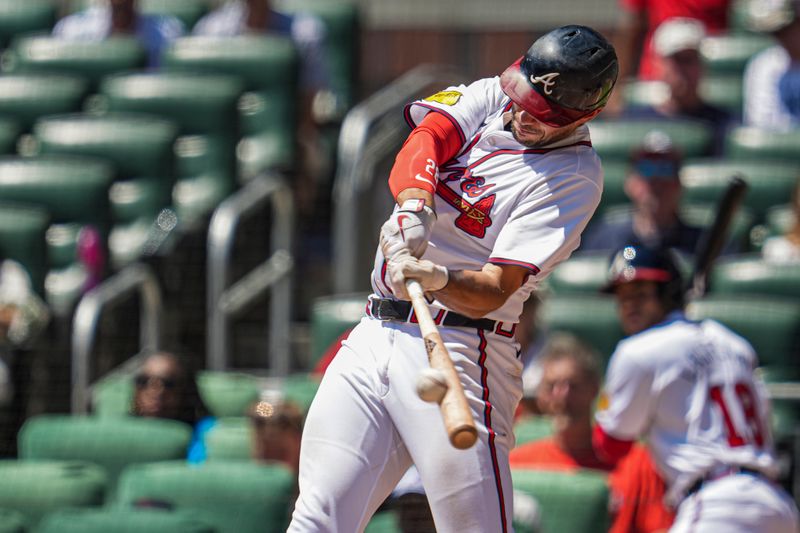 Aug 25, 2024; Cumberland, Georgia, USA; Atlanta Braves first baseman Matt Olson (28) hits a home run against the Washington Nationals during the sixth inning at Truist Park. Mandatory Credit: Dale Zanine-USA TODAY Sports