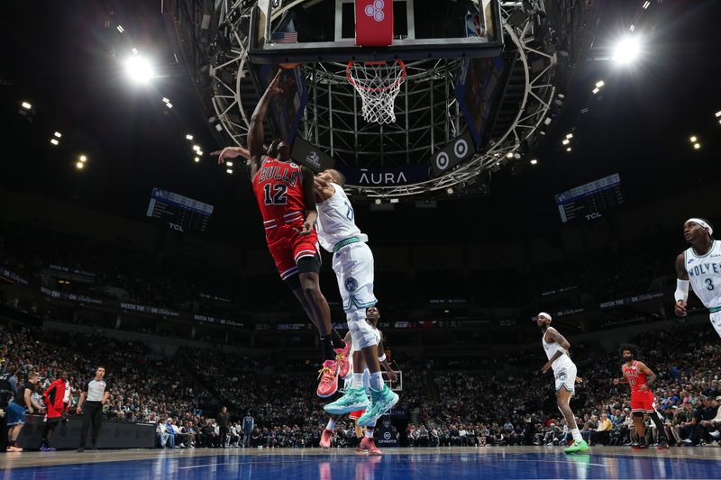 MINNEAPOLIS, MN -  MARCH 31: Ayo Dosunmu #12 of the Chicago Bulls drives to the basket during the game against the Minnesota Timberwolves on March 31, 2024 at Target Center in Minneapolis, Minnesota. NOTE TO USER: User expressly acknowledges and agrees that, by downloading and or using this Photograph, user is consenting to the terms and conditions of the Getty Images License Agreement. Mandatory Copyright Notice: Copyright 2024 NBAE (Photo by David Sherman/NBAE via Getty Images)