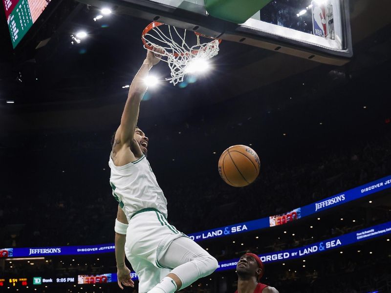 BOSTON, MA - DECEMBER 14: Jayson Tatum #0 of the Boston Celtics shouts out after dunking against Caris LeVert #3 of the Cleveland Cavaliers during the second half at TD Garden on December 14, 2023 in Boston, Massachusetts. NOTE TO USER: User expressly acknowledges and agrees that, by downloading and/or using this Photograph, user is consenting to the terms and conditions of the Getty Images License Agreement. (Photo By Winslow Townson/Getty Images)