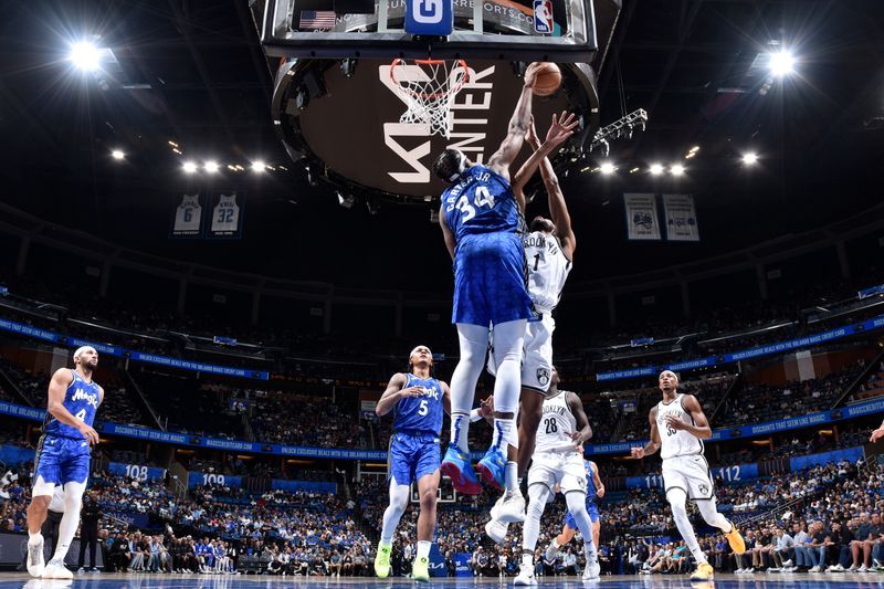 ORLANDO, FL - MARCH 13: Wendell Carter Jr. #34 of the Orlando Magic blocks the shot during the game against the Brooklyn Nets on March 13, 2024 at the Kia Center in Orlando, Florida. NOTE TO USER: User expressly acknowledges and agrees that, by downloading and or using this photograph, User is consenting to the terms and conditions of the Getty Images License Agreement. Mandatory Copyright Notice: Copyright 2024 NBAE (Photo by Fernando Medina/NBAE via Getty Images)