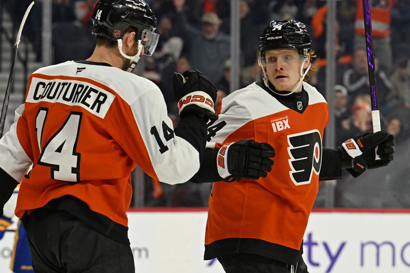Dec 3, 2025; Philadelphia, Pennsylvania, USA; Philadelphia Flyers right wing Owen Tippett (74) celebrates his goal with center Sean Couturier (14) against the Buffalo Sabres during the second period at Xfinity Mobile Arena. Mandatory Credit: Eric Hartline-Imagn Images