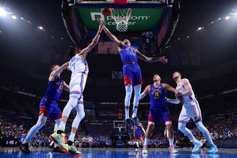 OKLAHOMA CITY, OK - MAY 13: Michael Porter Jr. #1 of the Denver Nuggets goes up for the rebound during the game against the Oklahoma City Thunder   during Round 2 Game 5 of the 2025 NBA Playoffs on May 13, 2025 at Paycom Center in Oklahoma City, Oklahoma. NOTE TO USER: User expressly acknowledges and agrees that, by downloading and or using this photograph, User is consenting to the terms and conditions of the Getty Images License Agreement. Mandatory Copyright Notice: Copyright 2025 NBAE (Photo by Garrett Ellwood/NBAE via Getty Images)