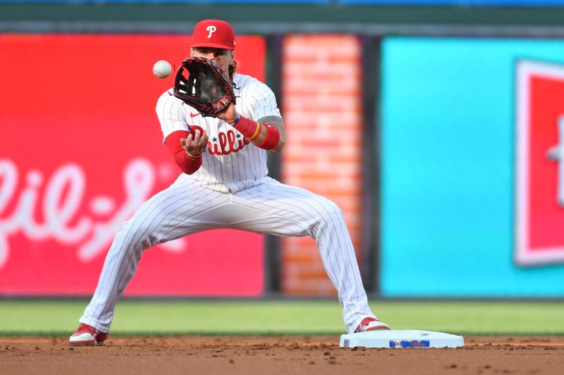 Jun 17, 2024; Philadelphia, Pennsylvania, USA; Philadelphia Phillies second base Bryson Stott (5) gets force out during the second inning against the San Diego Padres at Citizens Bank Park. Mandatory Credit: Eric Hartline-USA TODAY Sports