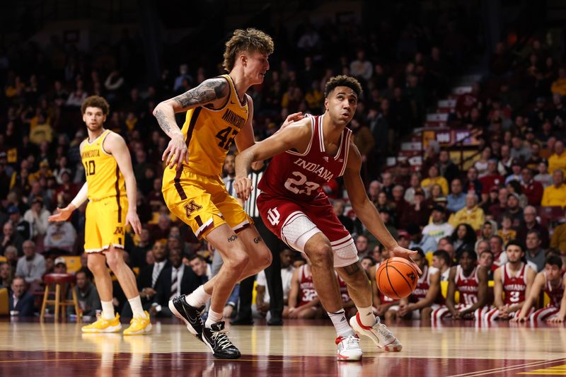 Jan 25, 2023; Minneapolis, Minnesota, USA; Indiana Hoosiers forward Trayce Jackson-Davis (23) drives to the basket while Minnesota Golden Gophers center Treyton Thompson (42) defends during the second half at Williams Arena. Mandatory Credit: Matt Krohn-USA TODAY Sports