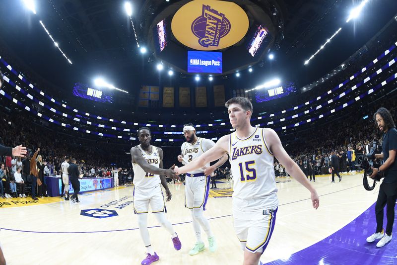 LOS ANGELES, CA - APRIL 27: Austin Reaves #15 and Taurean Prince #12 of the Los Angeles Lakers high five after the game against the Denver Nuggets during Round 1 Game 4 of the 2024 NBA Playoffs on April 27, 2024 at Crypto.Com Arena in Los Angeles, California. NOTE TO USER: User expressly acknowledges and agrees that, by downloading and/or using this Photograph, user is consenting to the terms and conditions of the Getty Images License Agreement. Mandatory Copyright Notice: Copyright 2024 NBAE (Photo by Andrew D. Bernstein/NBAE via Getty Images)