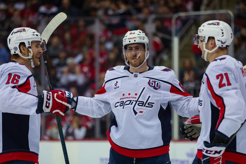 Nov 30, 2024; Newark, New Jersey, USA; Washington Capitals left wing Pierre-Luc Dubois (80) celebrates his goal against the New Jersey Devils during the third period at Prudential Center. Mandatory Credit: Thomas Salus-Imagn Images