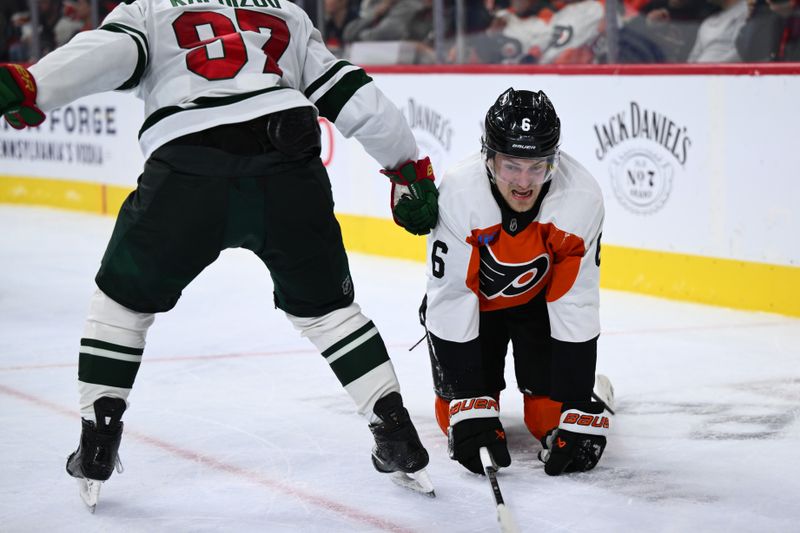 Oct 26, 2024; Philadelphia, Pennsylvania, USA; Philadelphia Flyers defenseman Travis Sanheim (6) gets caught in against the stick of Minnesota Wild left wing Kirill Kaprizov (97) in the second period at Wells Fargo Center. Mandatory Credit: Kyle Ross-Imagn Images