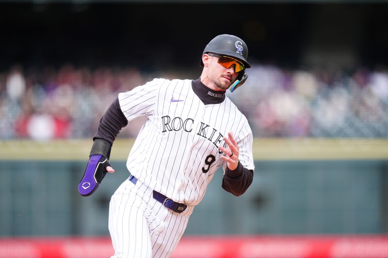 May 9, 2024; Denver, Colorado, USA; Colorado Rockies outfielder Brenton Doyle (9) heads home to score in eighth inning against the San Francisco Giants at Coors Field. Mandatory Credit: Ron Chenoy-USA TODAY Sports