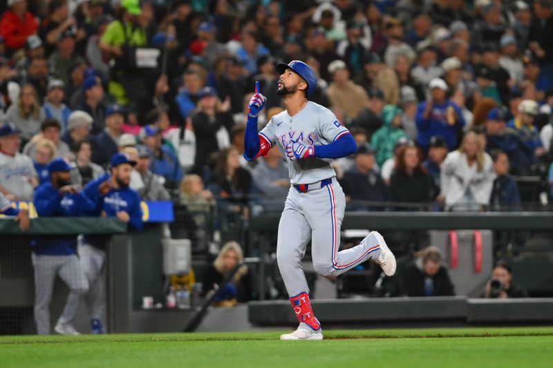 Sep 14, 2024; Seattle, Washington, USA; Texas Rangers center fielder Leody Taveras (3) runs the bases after hitting a 2-run home against the Seattle Mariners during the third inning at T-Mobile Park. Mandatory Credit: Steven Bisig-Imagn Images