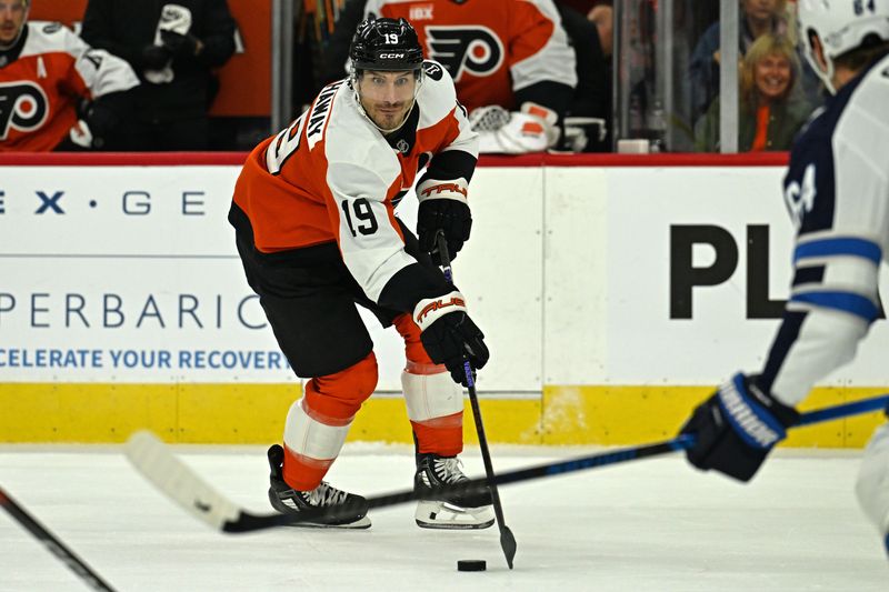 Oct 16, 2025; Philadelphia, Pennsylvania, USA; Philadelphia Flyers right wing Garnet Hathaway (19) carries the puck against the Winnipeg Jets during the second period at Wells Fargo Center. Mandatory Credit: Eric Hartline-Imagn Images