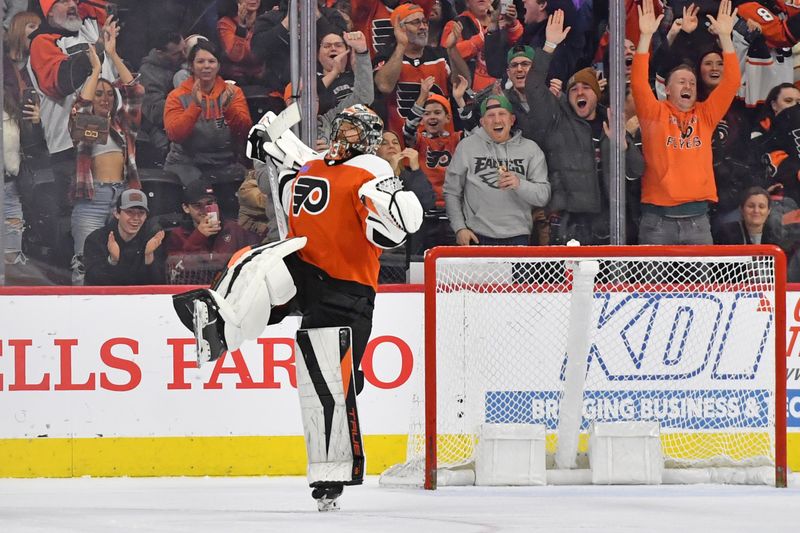 Jan 10, 2024; Philadelphia, Pennsylvania, USA; Philadelphia Flyers goaltender Samuel Ersson (33) celebrates after making the final save during the shootout in win against the Montreal Canadiens at Wells Fargo Center. Mandatory Credit: Eric Hartline-USA TODAY Sports