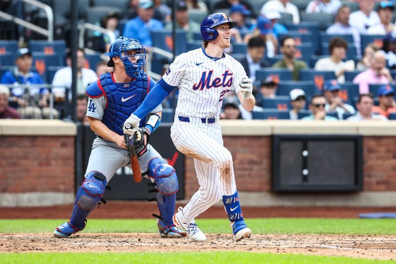 May 29, 2024; New York City, New York, USA;  New York Mets third base Brett Baty (22) hits a single in the third inning against the Los Angeles Dodgers at Citi Field. Mandatory Credit: Wendell Cruz-USA TODAY Sports