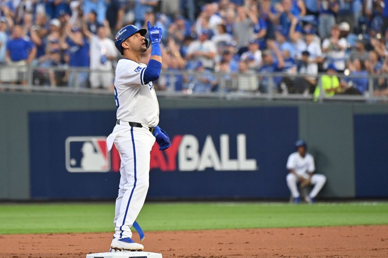 Oct 9, 2024; Kansas City, Missouri, USA; Kansas City Royals first base Yuli Gurriel (18) reacts after hitting a double against the New York Yankees  during game three of the NLDS for the 2024 MLB Playoffs at Kauffman Stadium. Mandatory Credit: Peter Aiken-Imagn Images