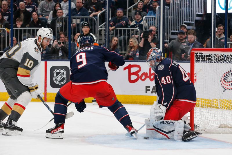 Mar 4, 2024; Columbus, Ohio, USA; Columbus Blue Jackets goalie Daniil Tarasov (40) makes a pad save as Vegas Golden Knights center Nicolas Roy (10) looks for a rebound during the first period at Nationwide Arena. Mandatory Credit: Russell LaBounty-USA TODAY Sports