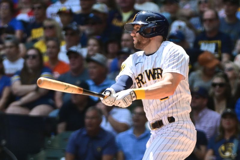 May 28, 2023; Milwaukee, Wisconsin, USA;  Milwaukee Brewers second baseman Owen Miller (6) hits a two RBI single against the San Francisco Giants in the second inning at American Family Field. Mandatory Credit: Benny Sieu-USA TODAY Sports