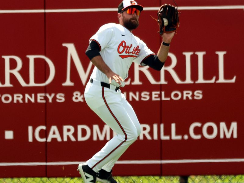 Mar 12, 2024; Sarasota, Florida, USA; Baltimore Orioles center fielder Colton Cowser (17) catches a fly ball during the second inning against the Tampa Bay Rays at Ed Smith Stadium. Mandatory Credit: Kim Klement Neitzel-USA TODAY Sports