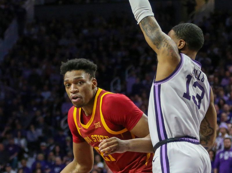 Feb 18, 2023; Manhattan, Kansas, USA; Iowa State Cyclones forward Osun Osunniyi (21) dribbles against Kansas State Wildcats guard Desi Sills (13) during the second half at Bramlage Coliseum. Mandatory Credit: Scott Sewell-USA TODAY Sports