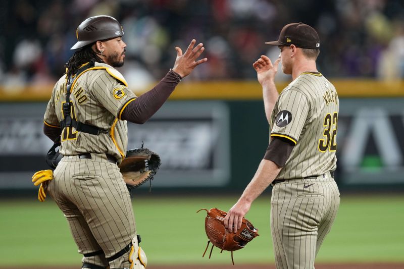 May 4, 2024; Phoenix, Arizona, USA; San Diego Padres catcher Luis Campusano (12) and San Diego Padres pitcher Stephen Kolek (32) shake hands after the ninth inning against the Arizona Diamondbacks at Chase Field. Mandatory Credit: Joe Camporeale-USA TODAY Sports