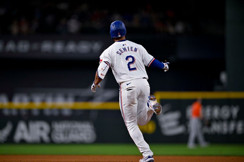 Aug 7, 2024; Arlington, Texas, USA;  Texas Rangers second baseman Marcus Semien (2) rounds the bases after he hits a home run against the Houston Astros during the sixth inning at Globe Life Field. Mandatory Credit: Jerome Miron-USA TODAY Sports