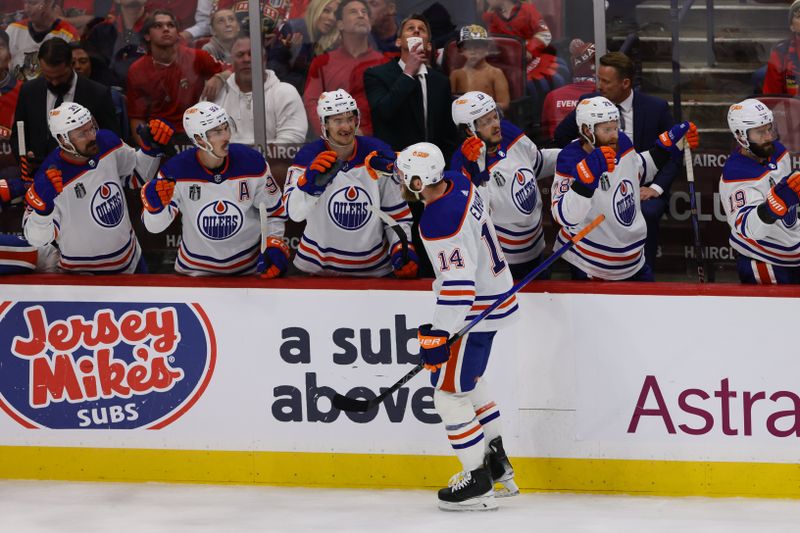 Jun 10, 2024; Sunrise, Florida, USA; Edmonton Oilers defenseman Mattias Ekholm (14) celebrates scoring against the Florida Panthers during the first period in game two of the 2024 Stanley Cup Final at Amerant Bank Arena. Mandatory Credit: Sam Navarro-USA TODAY Sports