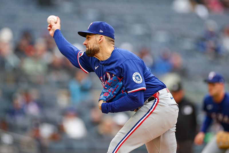 May 22, 2025; Bronx, New York, USA; Texas Rangers starting pitcher Nathan Eovaldi (17) delivers a pitch during the first inning against the New York Yankees at Yankee Stadium. Mandatory Credit: Vincent Carchietta-Imagn Images