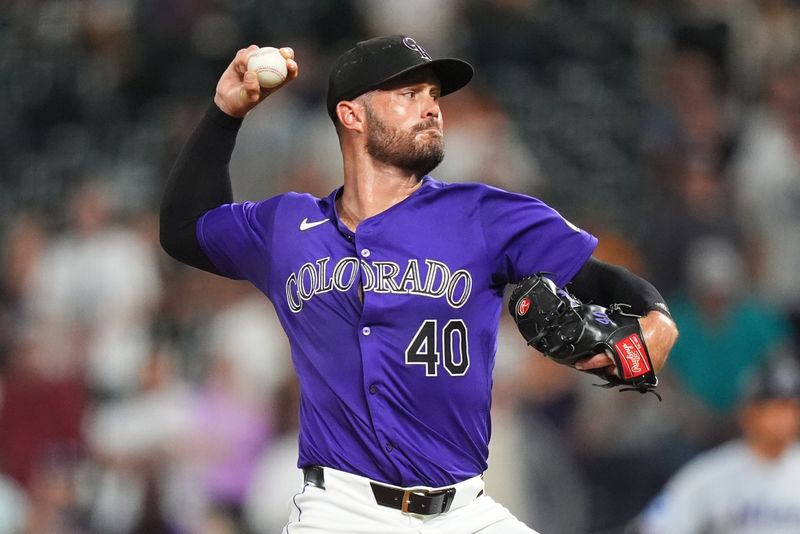 Aug 26, 2024; Denver, Colorado, USA; Colorado Rockies relief pitcher Tyler Kinley (40) delivers a pitch in the ninth inning against the Miami Marlins at Coors Field. Mandatory Credit: Ron Chenoy-USA TODAY Sports