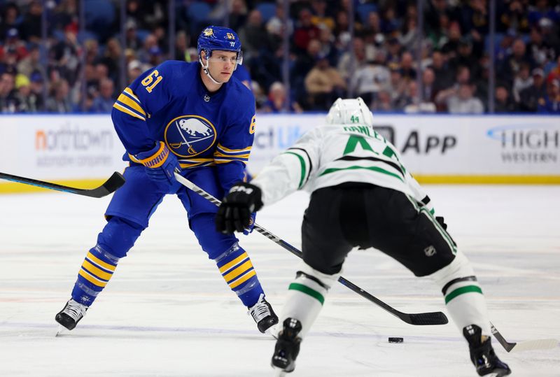 Mar 9, 2023; Buffalo, New York, USA;  Buffalo Sabres defenseman Riley Stillman (61) looks to make a pass during the second period against the Dallas Stars at KeyBank Center. Mandatory Credit: Timothy T. Ludwig-USA TODAY Sports