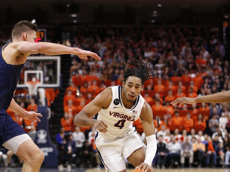 Feb 18, 2023; Charlottesville, Virginia, USA; Virginia Cavaliers guard Armaan Franklin (4) dribbles the ball as Notre Dame Fighting Irish forward Nate Laszewski (14) defends during the second half at John Paul Jones Arena. Mandatory Credit: Amber Searls-USA TODAY Sports