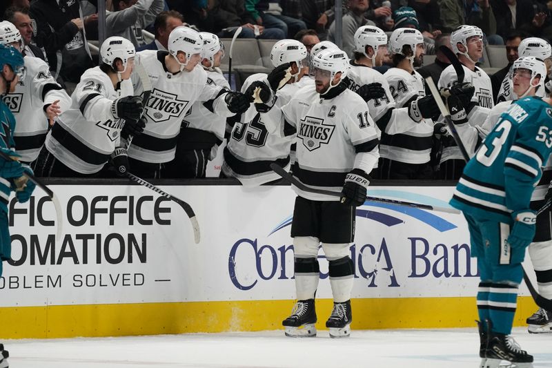 Nov 25, 2024; San Jose, California, USA; Los Angeles Kings center Anze Kopitar (11) is congratulated by teammates after scoring against the San Jose Sharks in the second period at SAP Center at San Jose. Mandatory Credit: David Gonzales-Imagn Images