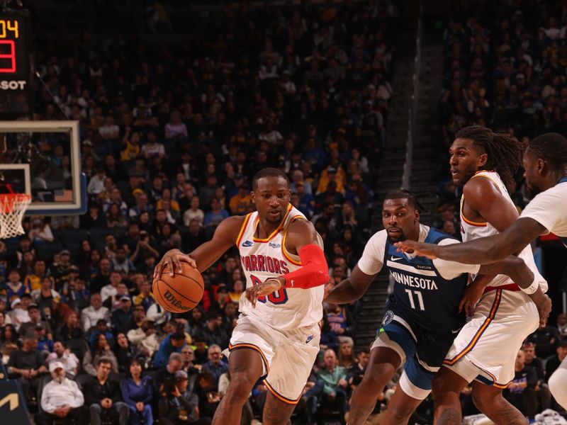 SAN FRANCISCO, CA - DECEMBER 8: Jonathan Kuminga #00 of the Golden State Warriors dribbles the ball during the game against the Minnesota Timberwolves on October 22, 2024 at Chase Center in San Francisco, California. NOTE TO USER: User expressly acknowledges and agrees that, by downloading and or using this photograph, user is consenting to the terms and conditions of Getty Images License Agreement. Mandatory Copyright Notice: Copyright 2024 NBAE (Photo by Jed Jacobsohn/NBAE via Getty Images)