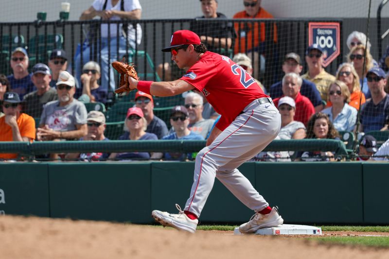 Mar 4, 2024; Lakeland, Florida, USA; Boston Red Sox first baseman Bobby Dalbec (29) catches a throw from the outfield during the first inning against the Detroit Tigers at Publix Field at Joker Marchant Stadium. Mandatory Credit: Mike Watters-USA TODAY Sports