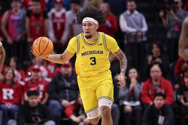 Feb 1, 2025; Piscataway, New Jersey, USA; Michigan Wolverines guard Tre Donaldson (3) dribbles up court during the first half against the Rutgers Scarlet Knights at Jersey Mike's Arena. Mandatory Credit: Vincent Carchietta-Imagn Images