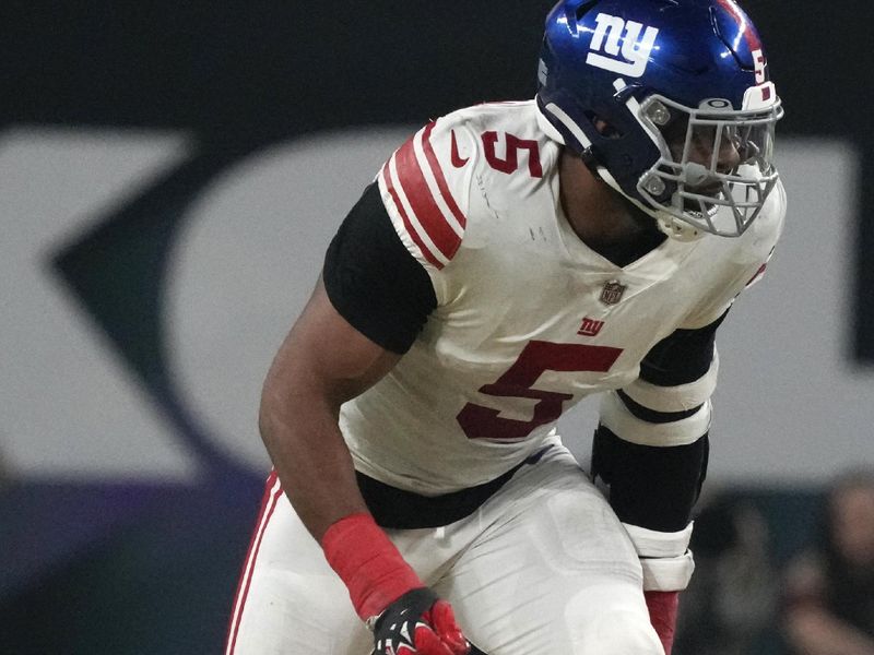 New York Giants defensive end Kayvon Thibodeaux (5) gets set for a play during second half of an NFL wild card playoff football game against the Minnesota Vikings, Sunday, Jan. 15, 2023, in Minneapolis. (AP Photo/Charlie Neibergall)