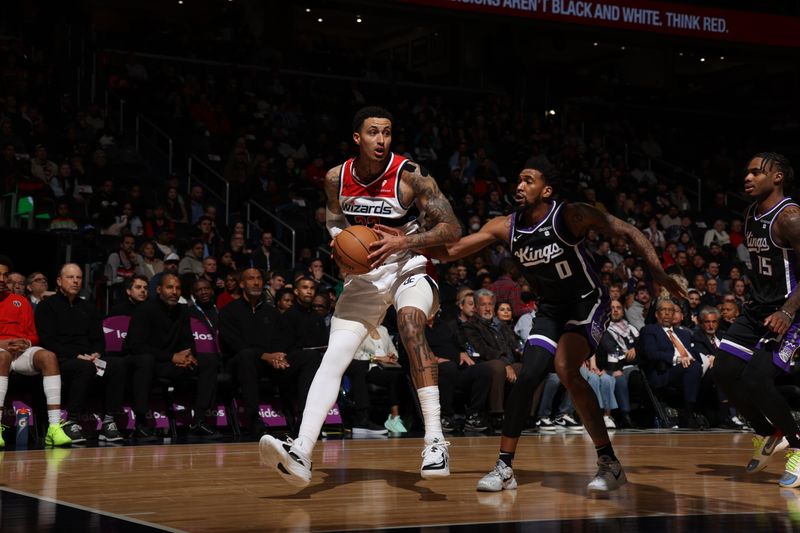 WASHINGTON, DC -? MARCH 21: Kyle Kuzma #33 of the Washington Wizards handles the ball against Malik Monk #0 of the Sacramento Kings during the game on March 21, 2024 at Capital One Arena in Washington, DC. NOTE TO USER: User expressly acknowledges and agrees that, by downloading and or using this Photograph, user is consenting to the terms and conditions of the Getty Images License Agreement. Mandatory Copyright Notice: Copyright 2024 NBAE (Photo by Stephen Gosling/NBAE via Getty Images)