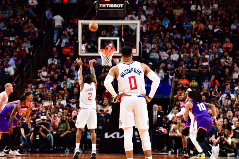 PHOENIX, AZ - APRIL 9: Russell Westbrook #0 of the LA Clippers looks on during a free throw attempt by teammate Kawhi Leonard #2 during the game against the Phoenix Suns on April 9, 2023 at Footprint Center in Phoenix, Arizona. NOTE TO USER: User expressly acknowledges and agrees that, by downloading and or using this photograph, user is consenting to the terms and conditions of the Getty Images License Agreement. Mandatory Copyright Notice: Copyright 2023 NBAE (Photo by Barry Gossage/NBAE via Getty Images)