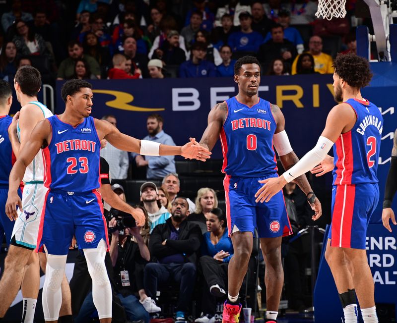 DETROIT, MI - MARCH 11: Jaden Ivey #23, Jalen Duren #0 and Cade Cunningham #2 of the Detroit Pistons high five during the game against the Charlotte Hornets  on March 11, 2024 at Little Caesars Arena in Detroit, Michigan. NOTE TO USER: User expressly acknowledges and agrees that, by downloading and/or using this photograph, User is consenting to the terms and conditions of the Getty Images License Agreement. Mandatory Copyright Notice: Copyright 2024 NBAE (Photo by Chris Schwegler/NBAE via Getty Images)