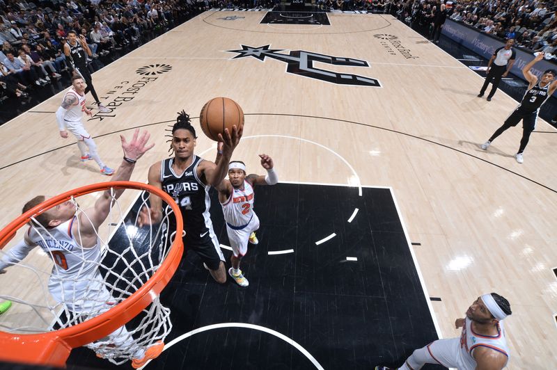 SAN ANTONIO, TX - MARCH 29: Devin Vassell #24 of the San Antonio Spurs drives to the basket during the game against the New York Knicks on March 29, 2024 at the Frost Bank Center in San Antonio, Texas. NOTE TO USER: User expressly acknowledges and agrees that, by downloading and or using this photograph, user is consenting to the terms and conditions of the Getty Images License Agreement. Mandatory Copyright Notice: Copyright 2024 NBAE (Photos by Michael Gonzales/NBAE via Getty Images)