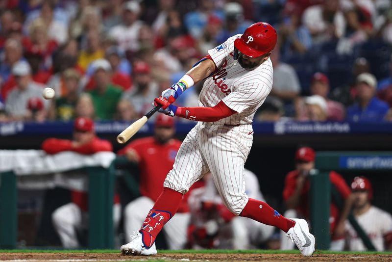 Sep 24, 2025; Philadelphia, Pennsylvania, USA; Philadelphia Phillies outfielder Kyle Schwarber (12) hits his second home run of the game during the seventh inning against the Miami Marlins at Citizens Bank Park. Mandatory Credit: Bill Streicher-Imagn Images