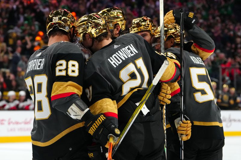 Mar 17, 2024; Las Vegas, Nevada, USA; Vegas Golden Knights left wing William Carrier (28) celebrates with team mates after scoring a goal against the New Jersey Devils during the third period at T-Mobile Arena. Mandatory Credit: Stephen R. Sylvanie-USA TODAY Sports