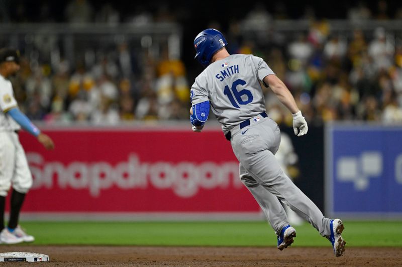 Oct 9, 2024; San Diego, California, USA; Los Angeles Dodgers catcher Will Smith (16) celebrates after hitting a two-run home run in the third inning against the San Diego Padres during game four of the NLDS for the 2024 MLB Playoffs at Petco Park.  Mandatory Credit: Denis Poroy-Imagn Images