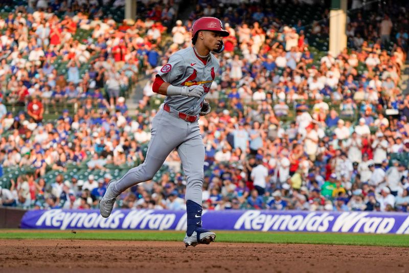 Aug 4, 2024; Chicago, Illinois, USA; St. Louis Cardinals shortstop Masyn Winn (0) runs the bases after hitting a two-run home run against the Chicago Cubs during the third inning at Wrigley Field. Mandatory Credit: David Banks-USA TODAY Sports