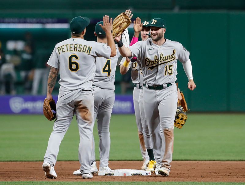 Jun 6, 2023; Pittsburgh, Pennsylvania, USA; The Oakland Athletics including second baseman Jace Peterson (6) and right fielder Seth Brown (15) celebrate after defeating the Pittsburgh Pirates at PNC Park. Oakland won 11-2.  Mandatory Credit: Charles LeClaire-USA TODAY Sports