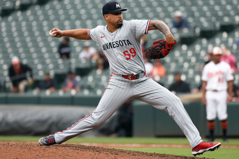 May 14, 2025; Baltimore, Maryland, USA; Minnesota Twins pitcher Jhoan Duran (59) throws during the ninth inning against the Baltimore Orioles at Oriole Park at Camden Yards. Mandatory Credit: Daniel Kucin Jr.-Imagn Images