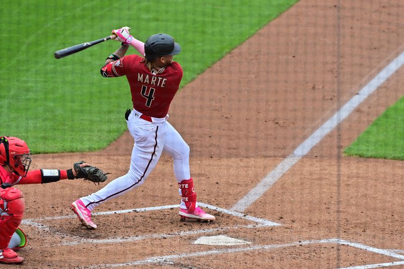 Mar 21, 2023; Salt River Pima-Maricopa, Arizona, USA; Arizona Diamondbacks second baseman Ketel Marte (4) hits a triple in the third inning against the Los Angeles Angels during a Spring Training game at Salt River Fields at Talking Stick. Mandatory Credit: Matt Kartozian-USA TODAY Sports