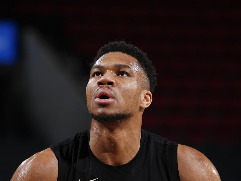 PORTLAND, OR - JANUARY 31:  Giannis Antetokounmpo #34 of the Milwaukee Bucks /warms-up before the game on January 31, 2024 at the Moda Center Arena in Portland, Oregon. NOTE TO USER: User expressly acknowledges and agrees that, by downloading and or using this photograph, user is consenting to the terms and conditions of the Getty Images License Agreement. Mandatory Copyright Notice: Copyright 2024 NBAE (Photo by Cameron Browne/NBAE via Getty Images)