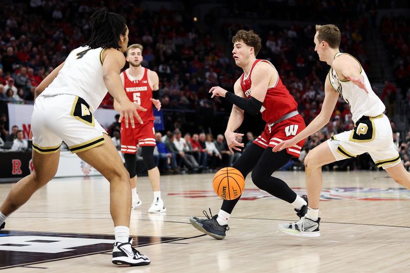 Mar 16, 2024; Minneapolis, MN, USA; Wisconsin Badgers guard Max Klesmit (11) passes as Purdue Boilermakers guard Fletcher Loyer (2) defends during the second half at Target Center. Mandatory Credit: Matt Krohn-USA TODAY Sports