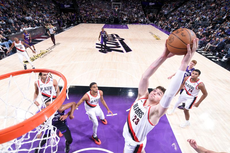 SACRAMENTO, CA - OCTOBER 28: Donovan Clingan #23 of the Portland Trail Blazers goes up for the rebound during the game against the Sacramento Kings on October 28, 2024 at Golden 1 Center in Sacramento, California. NOTE TO USER: User expressly acknowledges and agrees that, by downloading and or using this Photograph, user is consenting to the terms and conditions of the Getty Images License Agreement. Mandatory Copyright Notice: Copyright 2024 NBAE (Photo by Rocky Widner/NBAE via Getty Images)