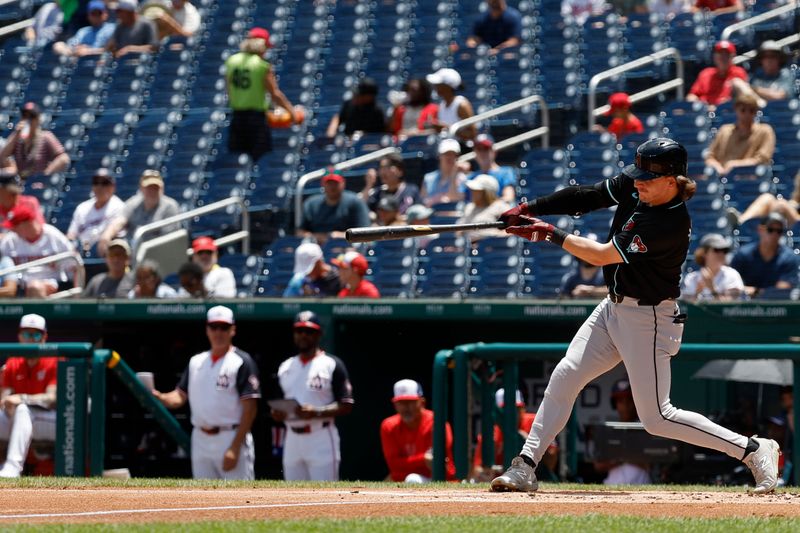 Jun 20, 2024; Washington, District of Columbia, USA; Arizona Diamondbacks outfielder Jake McCarthy (31) singles against the Washington Nationals during the second inning at Nationals Park. Mandatory Credit: Geoff Burke-USA TODAY Sports